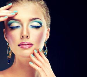 Trendy make-up and manicure ,a model with a bright makeup
